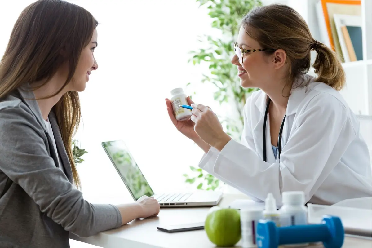 Doctor recommending supplements to patient in clinic