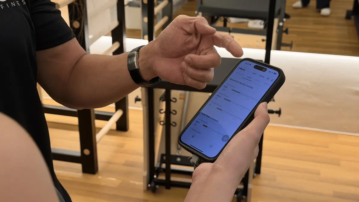 Pilates instructor explaining InBody results on the InBody App