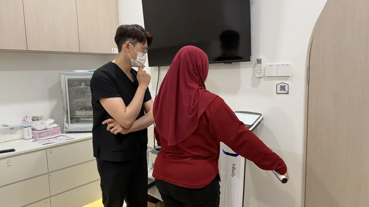 Doctor assisting his patient during clinic follow up 